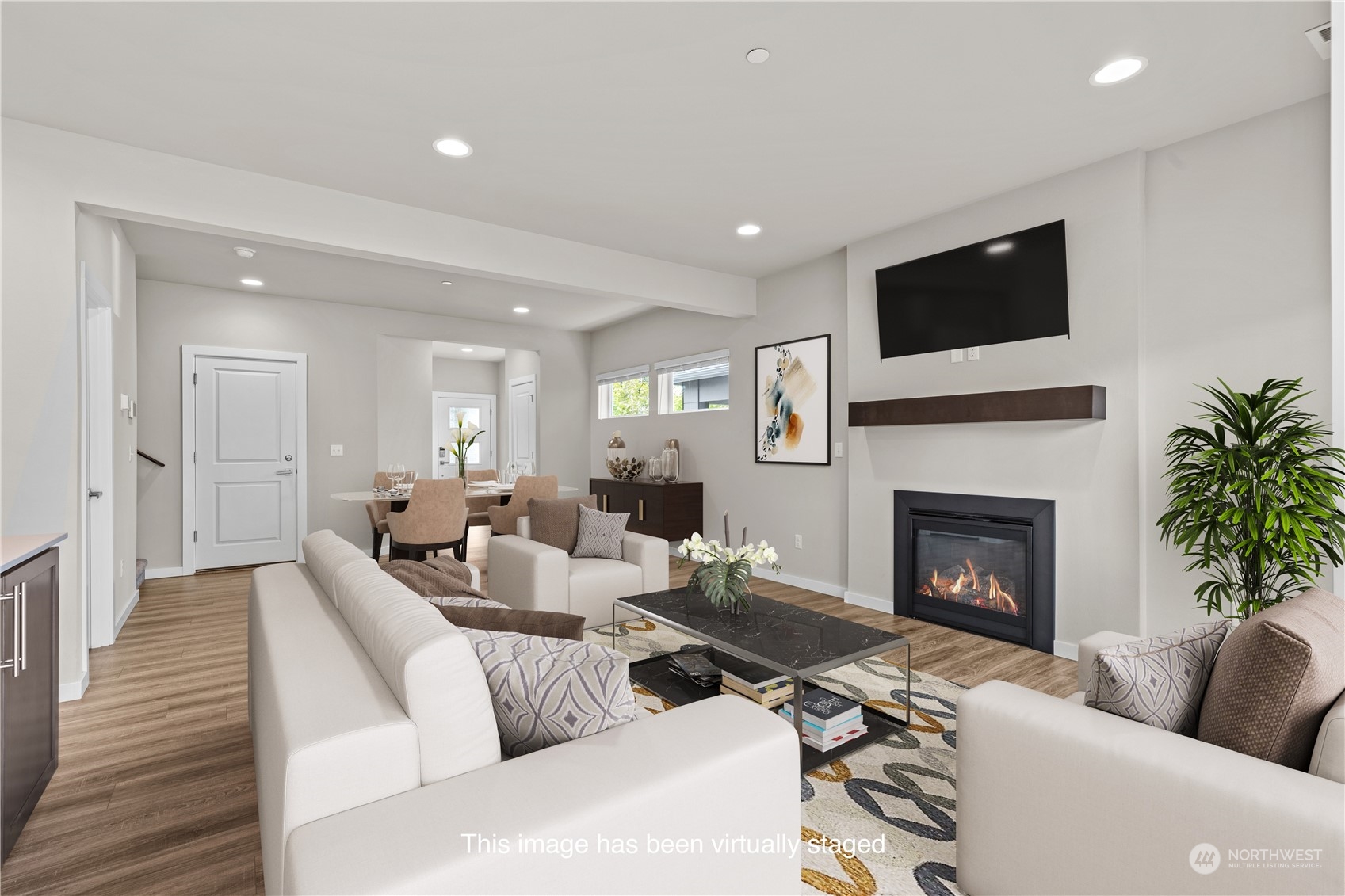 20713 42nd Avenue Southeast, Unit A Bothell, WA 98021 - Photo 10 of 32 a living room with furniture a fireplace and a flat screen tv