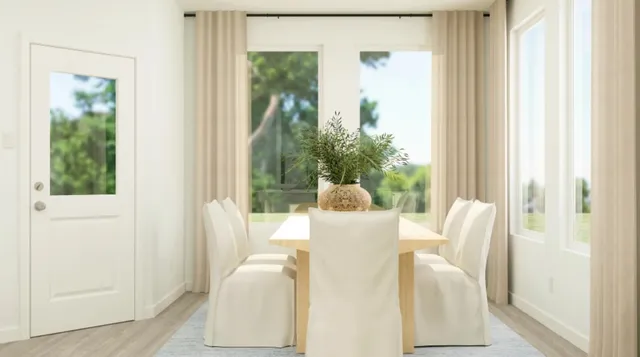 a view of a dining room with furniture window and outside view