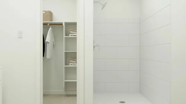 a bathroom with a glass shower door