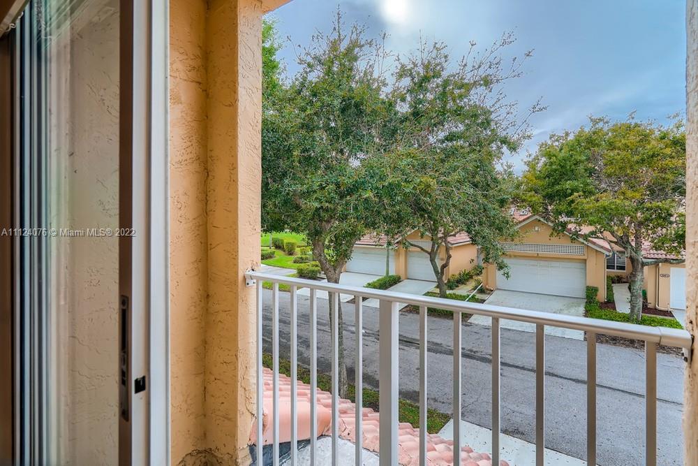23060 Aqua, Unit 8 Boca Raton, FL 33433 - Photo 28 of 33 a view of a balcony