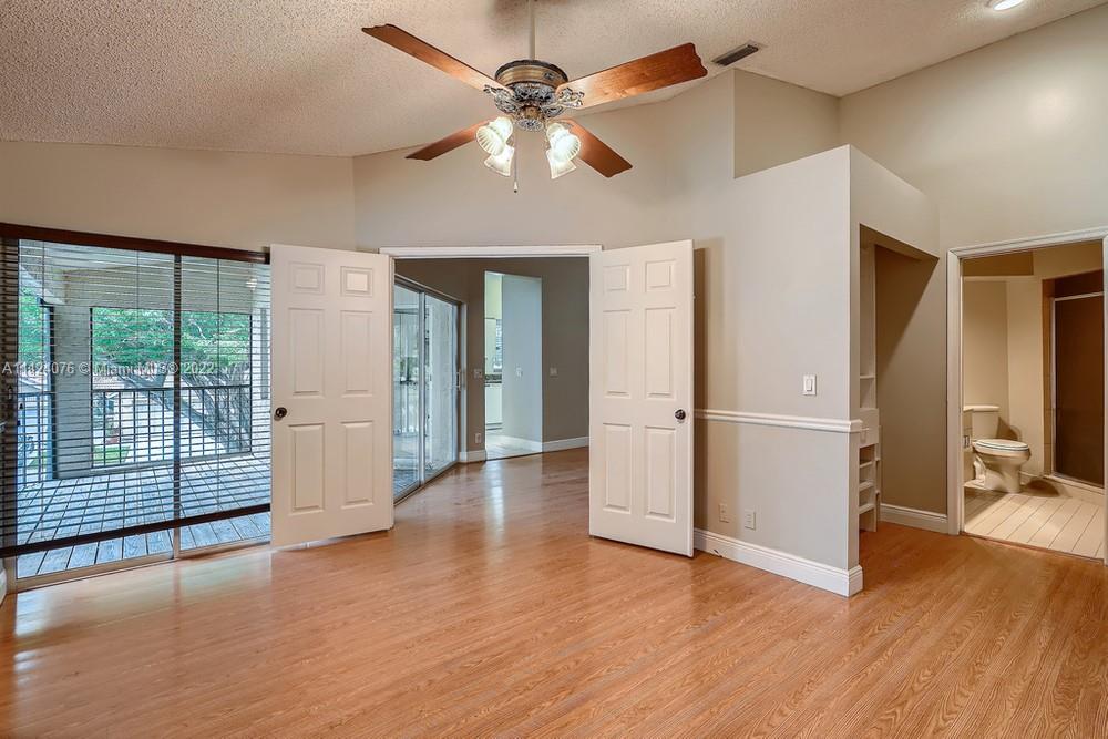 23060 Aqua, Unit 8 Boca Raton, FL 33433 - Photo 6 of 33 a view of a livingroom with wooden floor