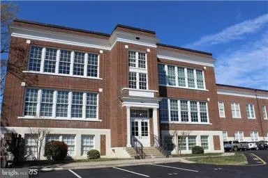 a front view of a building with street view