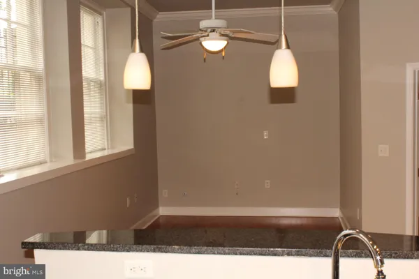 a view of a window with a chandelier fan