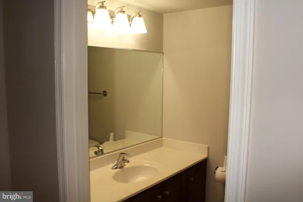 a bathroom with a sink and mirror