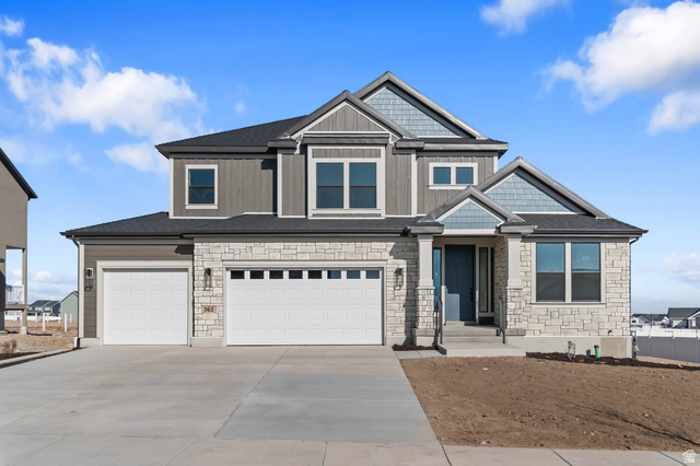 562 West Coyote Rdg Road Grantsville, UT 84029 - Photo 1 of 27 Modern two-story residence featuring a stone and siding exterior