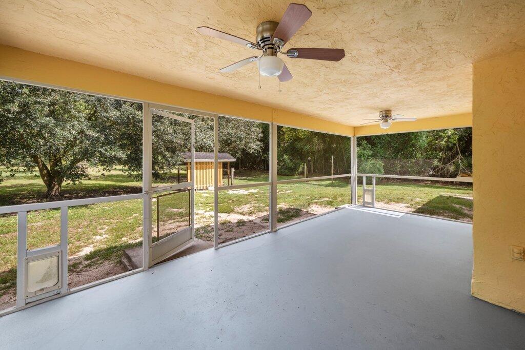 2812 F Road Loxahatchee, FL 33470 - Photo 19 of 25 screened back porch