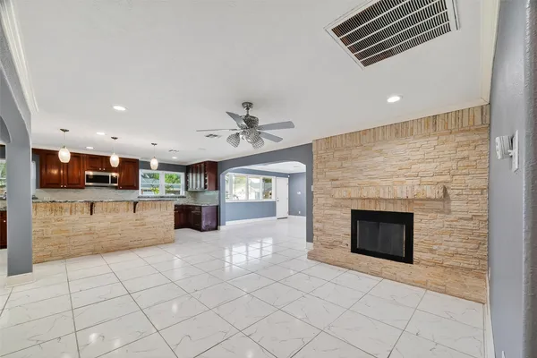 a view of kitchen with furniture and fireplace