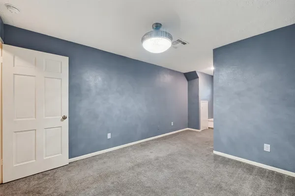 an empty room with closet area