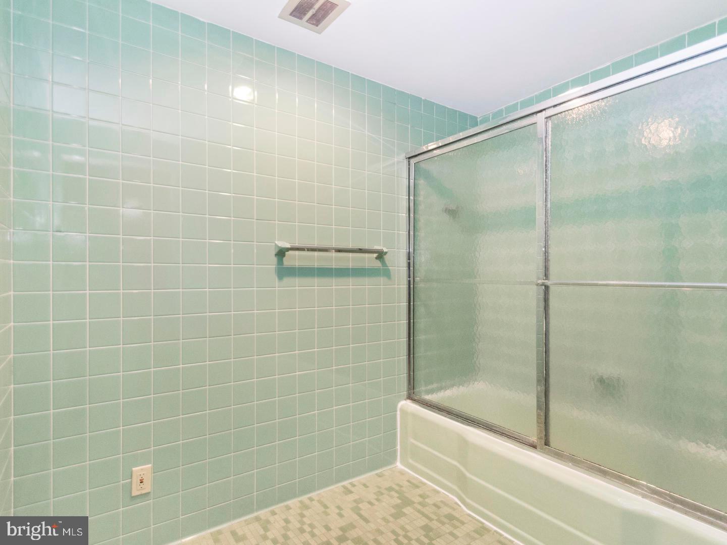 104 Powell Road Springfield, PA 19064 - Photo 16 of 30 a bathroom with a shower and a bathtub