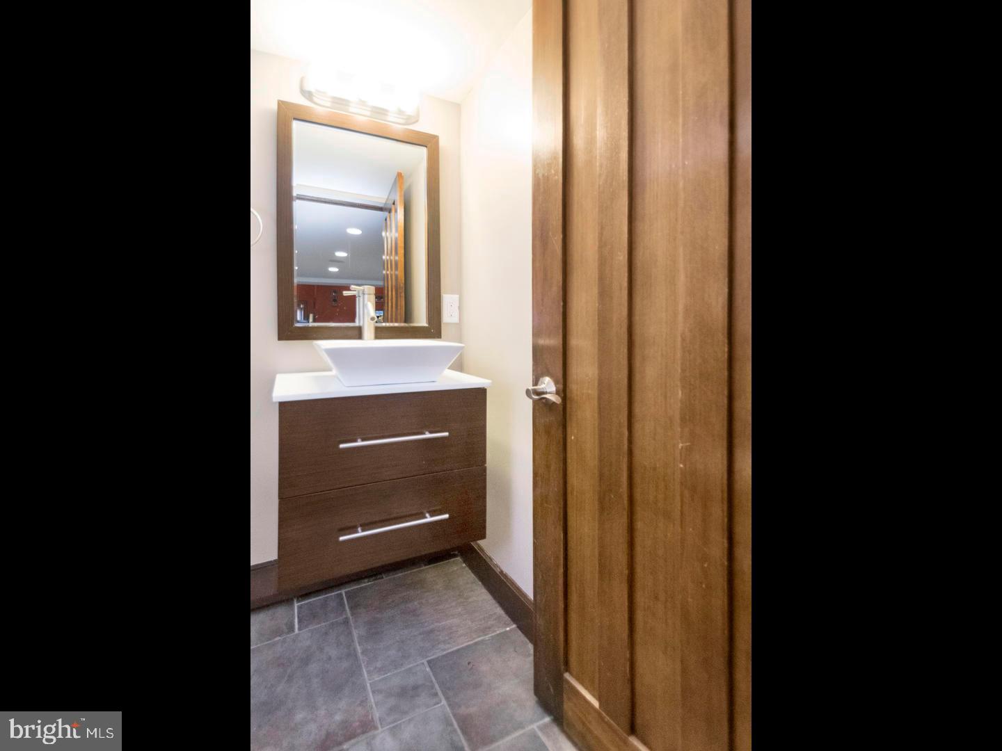 104 Powell Road Springfield, PA 19064 - Photo 19 of 30 a view of a bathroom from the hallway
