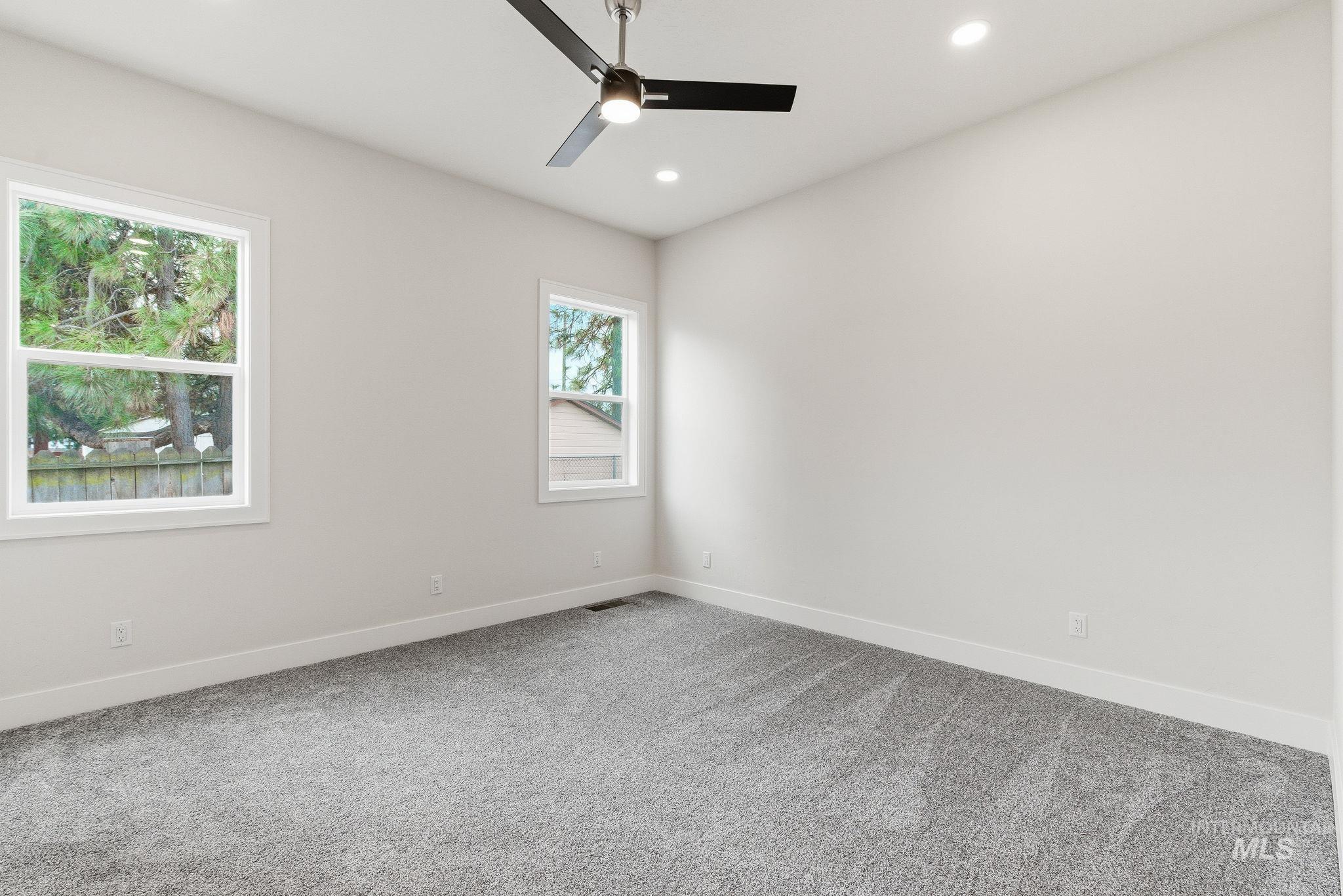 6821 West Ustick Road Boise, ID 83704 - Photo 22 of 42 Carpeted spare room featuring recessed lighting and a ceiling fan