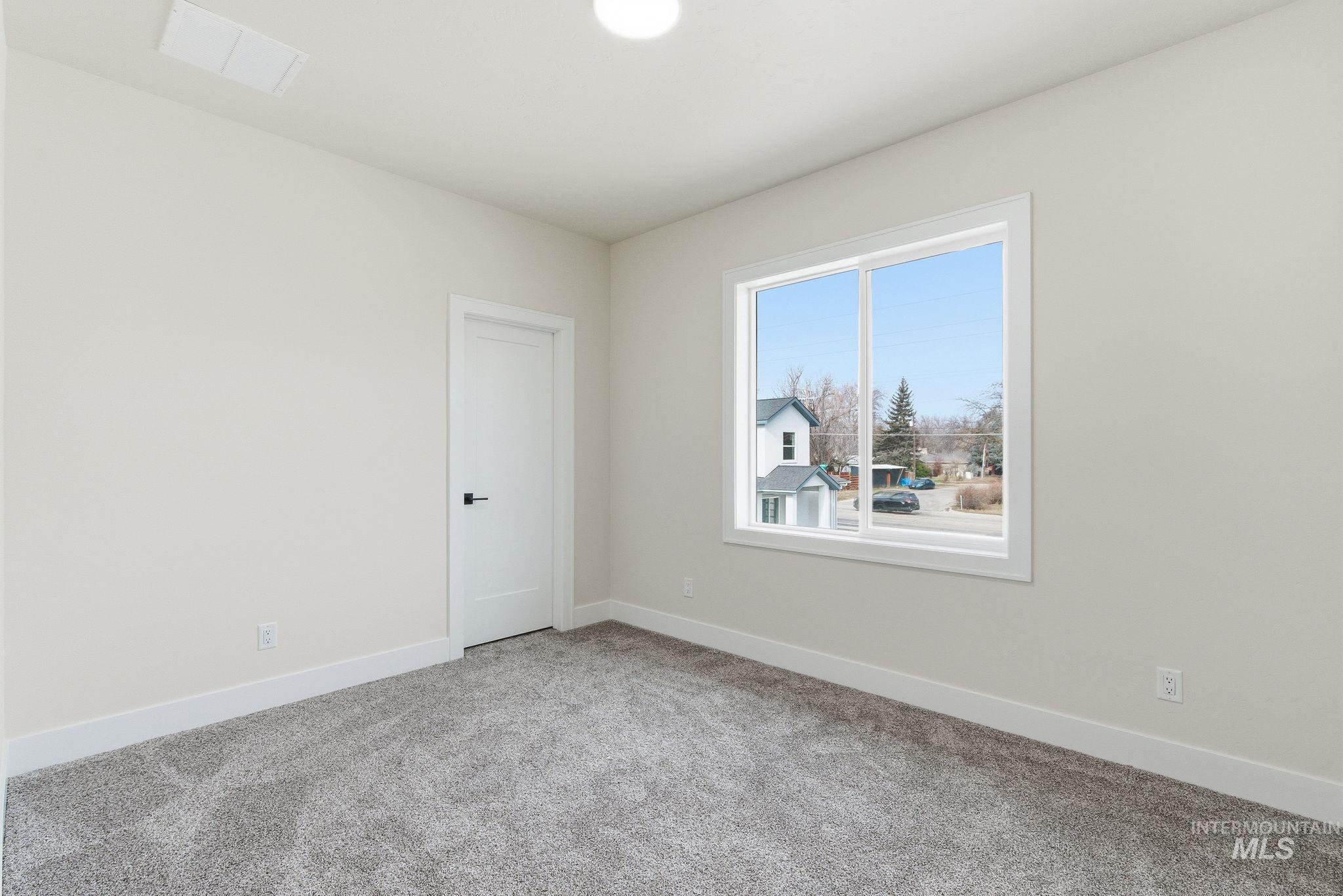 6821 West Ustick Road Boise, ID 83704 - Photo 25 of 42 Unfurnished room with baseboards and light carpet