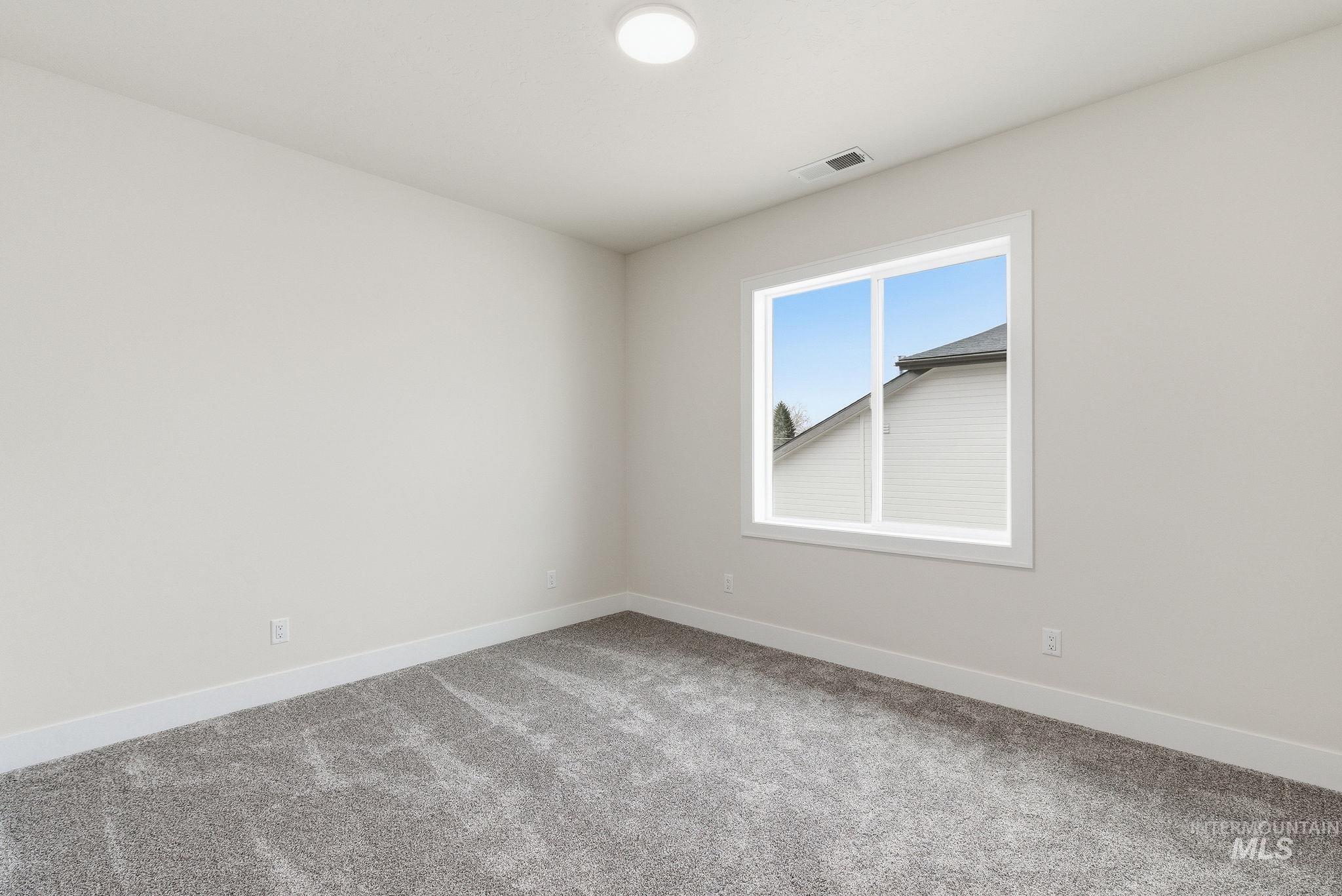 6821 West Ustick Road Boise, ID 83704 - Photo 27 of 42 Carpeted empty room with baseboards