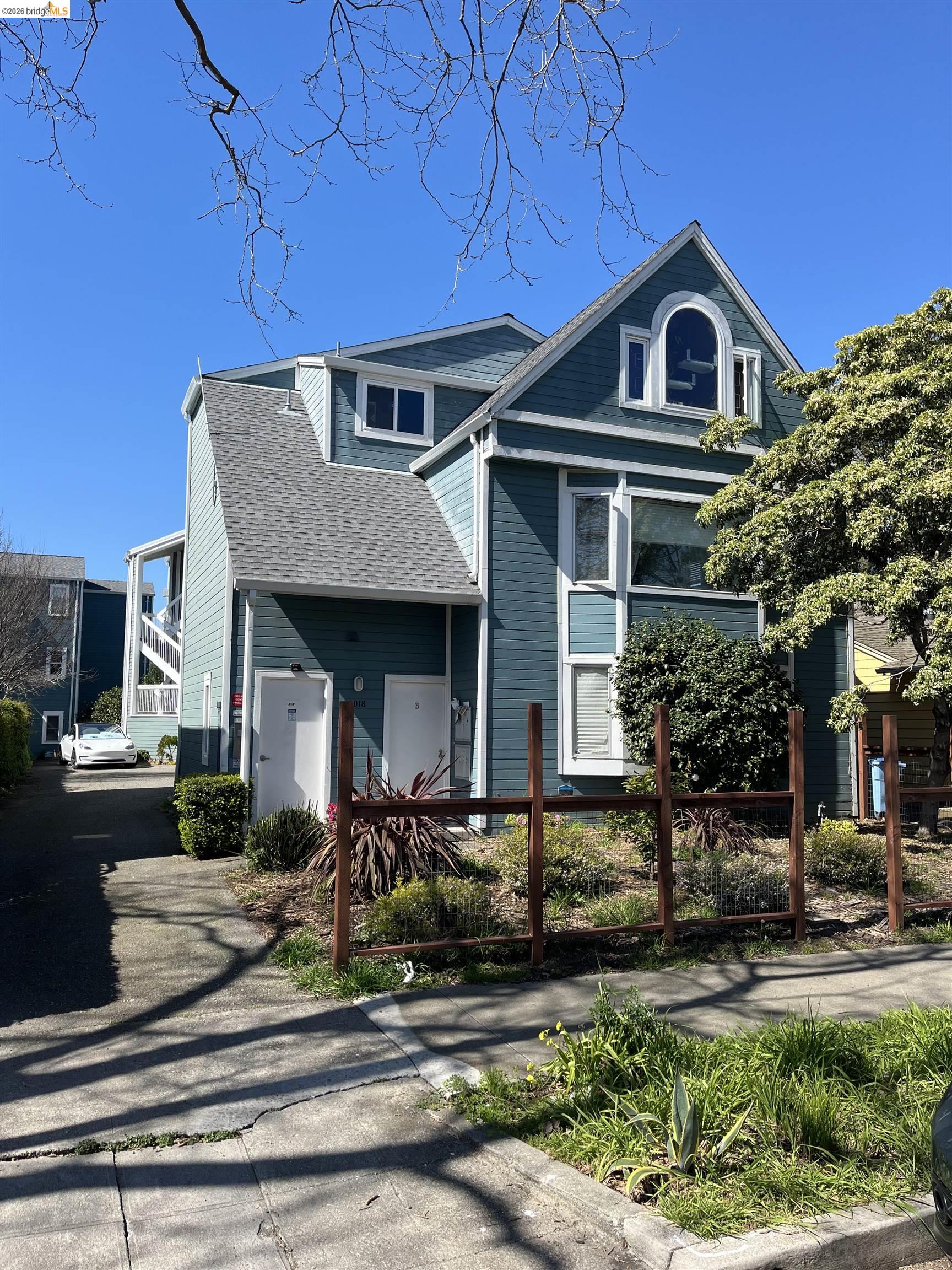 2018 Ninth Street, Unit B Berkeley, CA 94710 - Photo 2 of 5 a front view of a house with garden