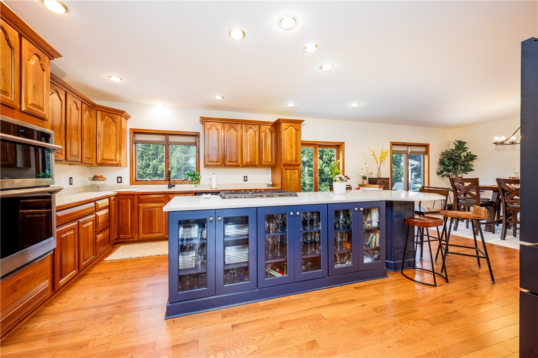 210 Buck Hill Road Greece, NY 14626 - Photo 11 of 49 COOK'S KITCHEN WITH BEAUTIFUL CABINETRY, ISLAND &