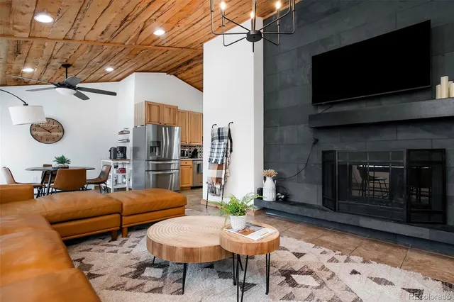 a outdoor living space with furniture and a fireplace