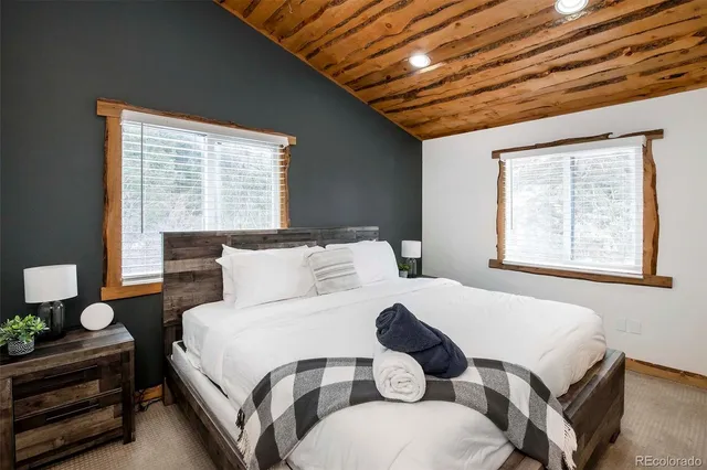 a bedroom with a bed and window