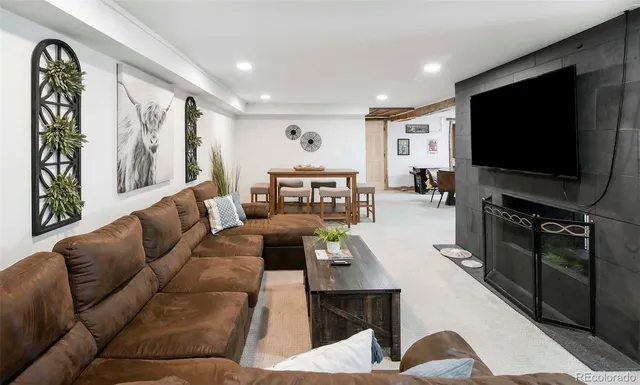 a living room with furniture and a flat screen tv