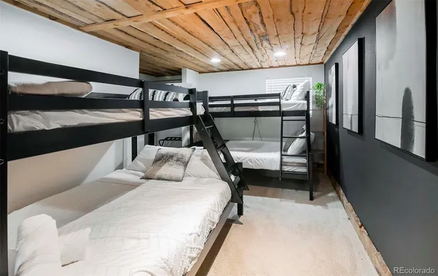 a bedroom with bed and balcony