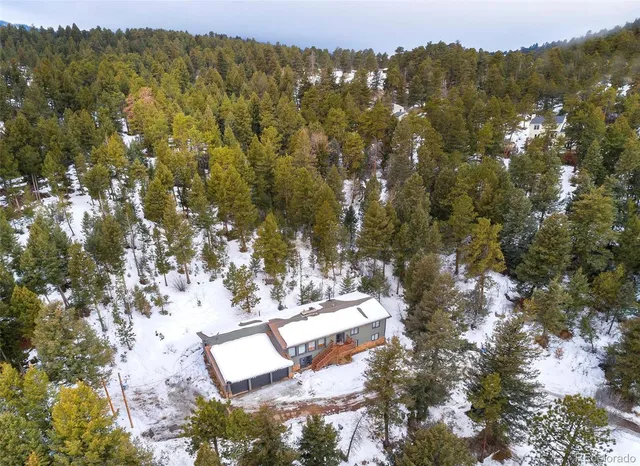 an aerial view of residential house with outdoor space