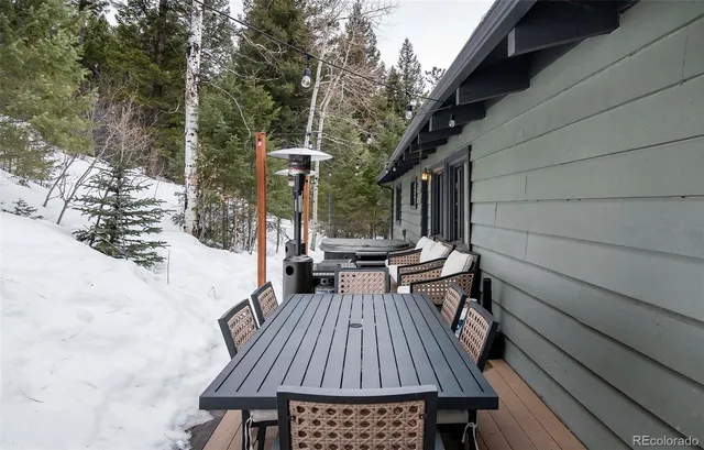 a view of balcony with wooden floor and outdoor seating