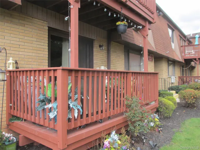 a view of a house with wooden fence