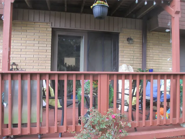 a front view of a house with outdoor seating