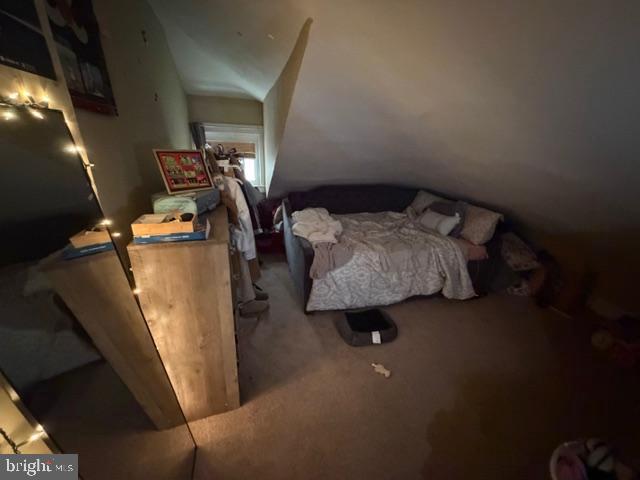 1319 Perry Street Reading, PA 19604 - Photo 14 of 16 a bed sitting in a bedroom next to a window