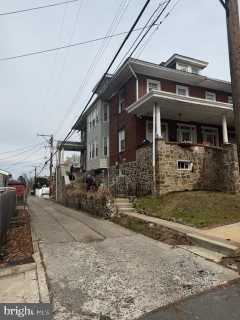 1319 Perry Street Reading, PA 19604 - Photo 2 of 16 a front view of a house with a yard