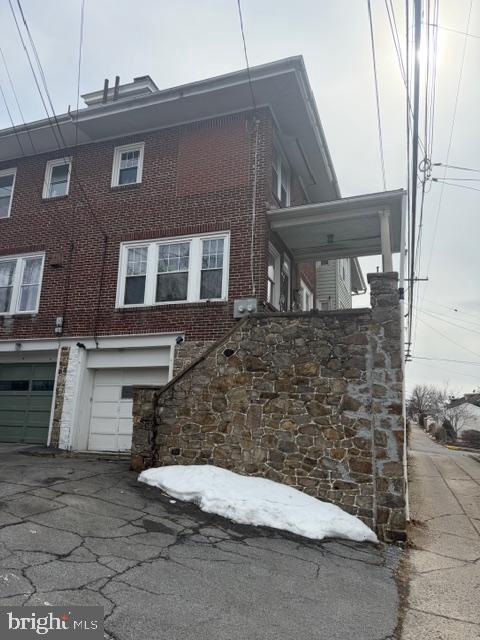 1319 Perry Street Reading, PA 19604 - Photo 3 of 16 a front view of a house with a yard
