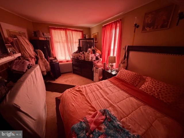 1319 Perry Street Reading, PA 19604 - Photo 6 of 16 a bed room with a bed and a window