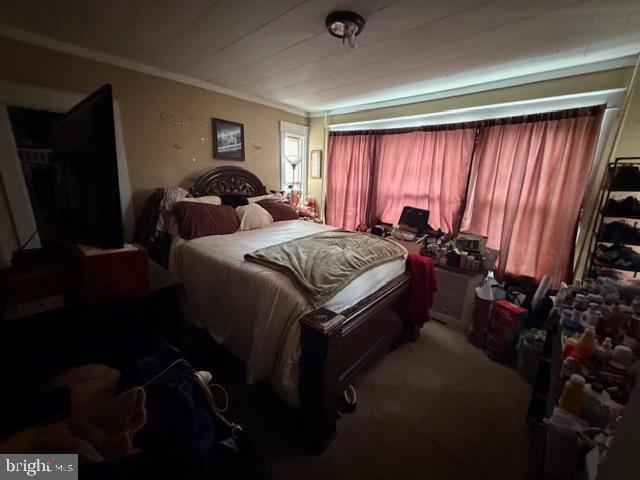 1319 Perry Street Reading, PA 19604 - Photo 10 of 16 a bed sitting in a room next to a window