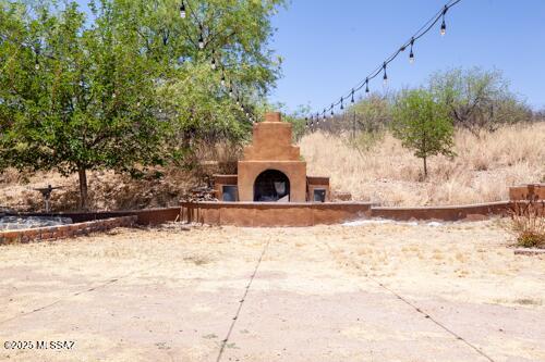 480 Camino Ramanote Rio Rico, AZ 85648 - Photo 28 of 43 Outdoor wood burning fireplace.