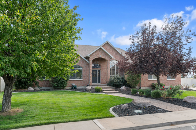 1501 West Elk Circle Mapleton, UT 84664 - Photo 1 of 39 Brick exterior residence featuring a front entry with an arched portico