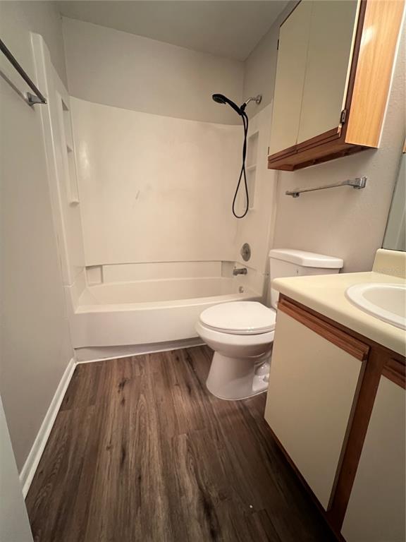 643 Dory Lane, Unit 202 Altamonte Springs, FL 32714 - Photo 5 of 14 a bathroom with a sink a toilet and shower