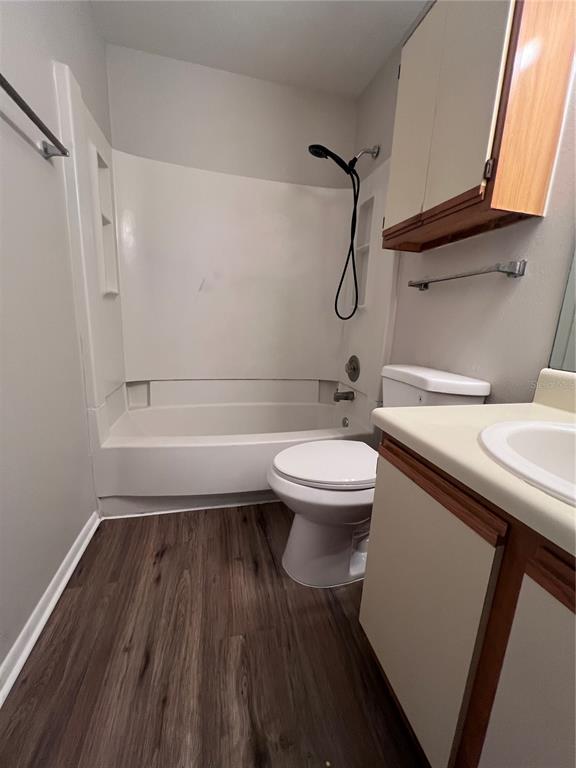 643 Dory Lane, Unit 202 Altamonte Springs, FL 32714 - Photo 6 of 14 a bathroom with a granite countertop toilet sink and mirror