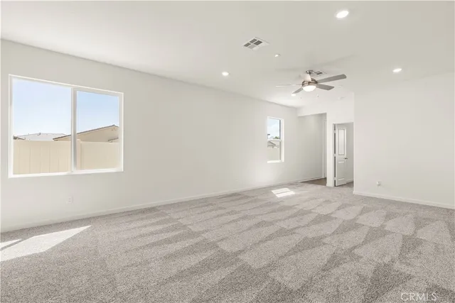 a view of a kitchen with a sink and a chandelier fan