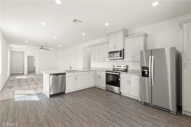 a view of kitchen with sink and window