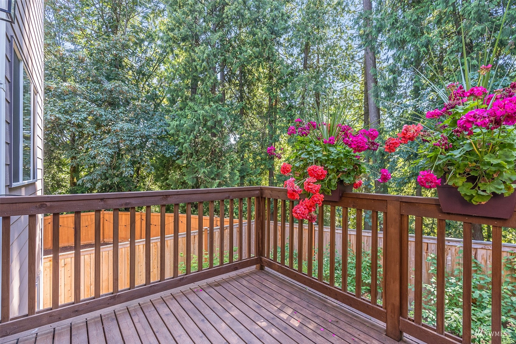 22811 23rd Avenue Southeast, Unit 11 Bothell, WA 98021 - Photo 25 of 30 a view of a balcony with flower plants