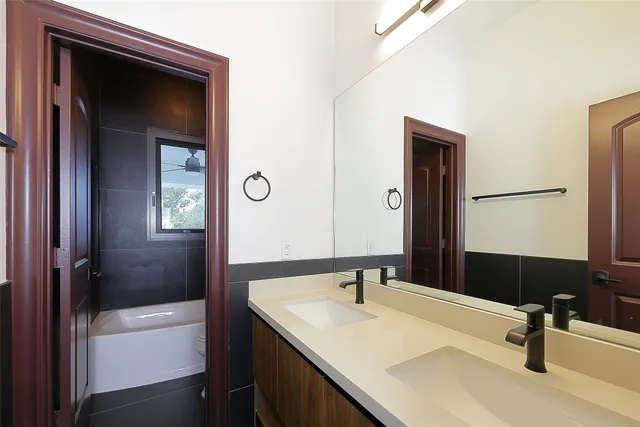a bathroom with a sink and a large mirror