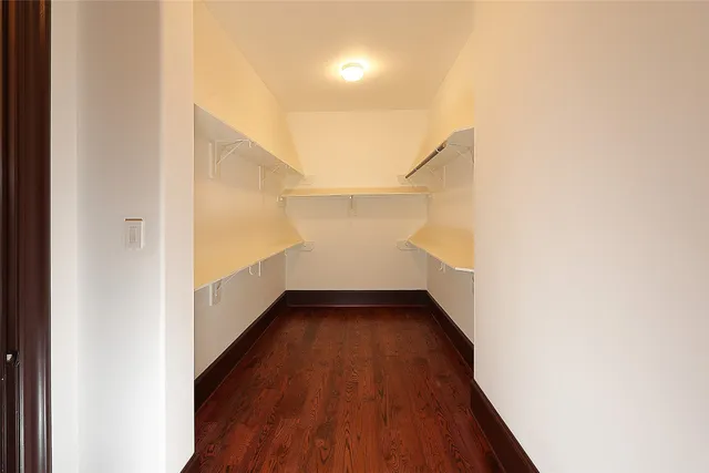 a view of hallway with wooden floor