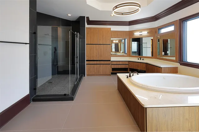 a large white kitchen with a large window