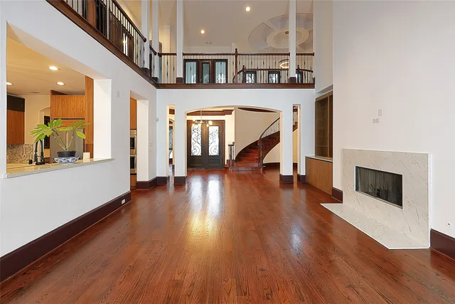 a view of an entryway with wooden floor