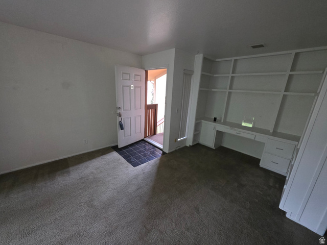 6852 Countrywoods Circle, Unit 5D Midvale, UT 84047 - Photo 32 of 50 Built in shelving and desk for office niche off living room.
