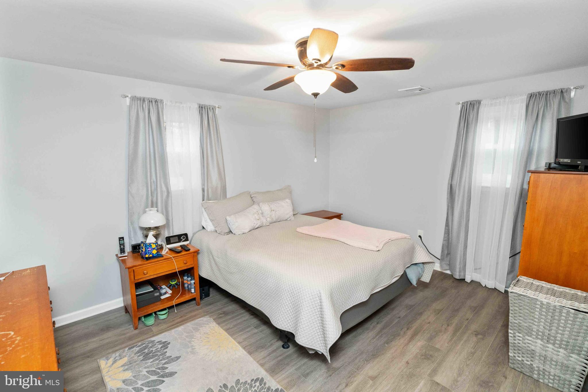 472 Woodward Drive Huntingdon Valley, PA 19006 - Photo 12 of 27 a bedroom with a bed and a chandelier