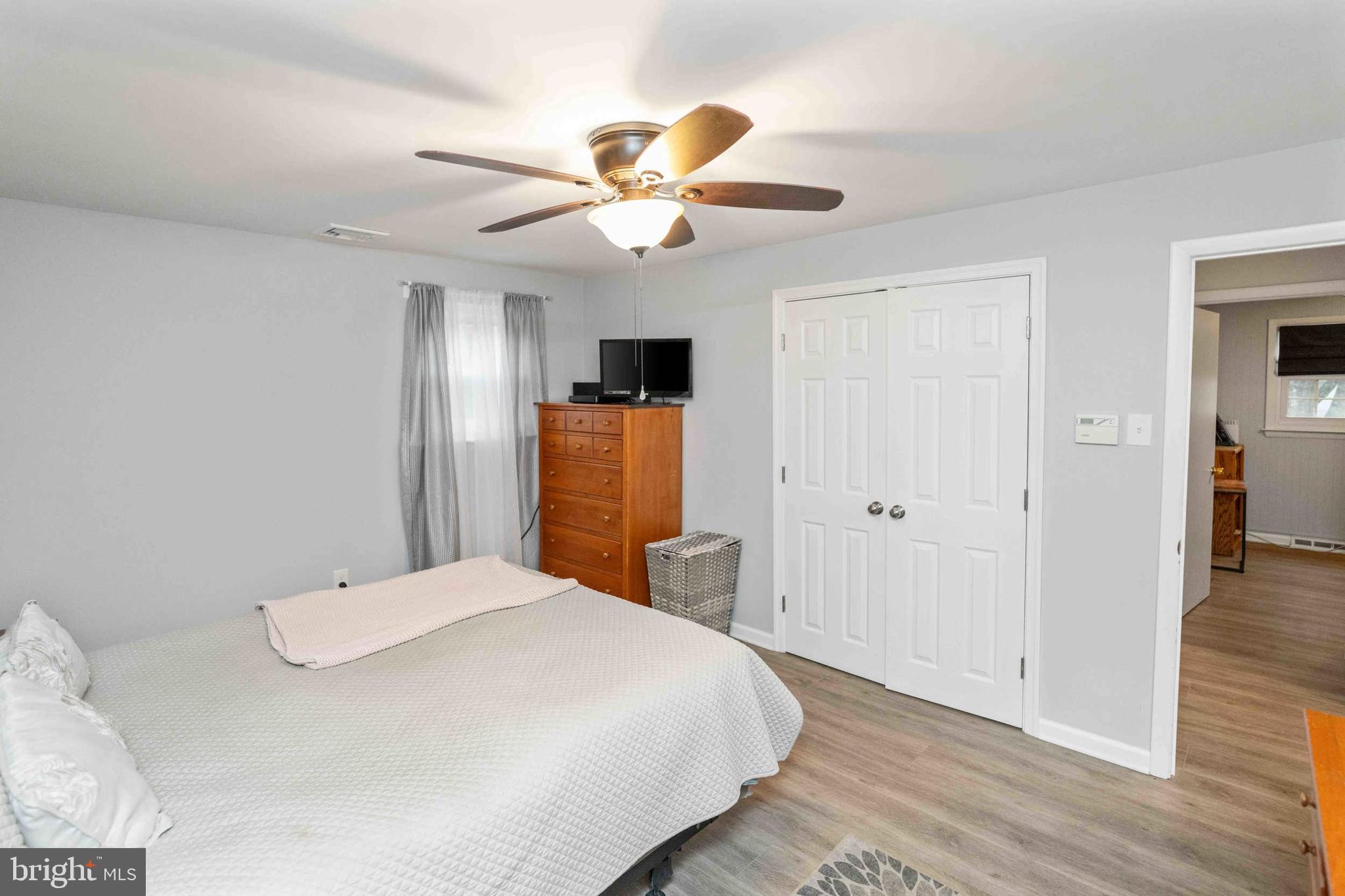 472 Woodward Drive Huntingdon Valley, PA 19006 - Photo 13 of 27 a bedroom with a bed and a chandelier