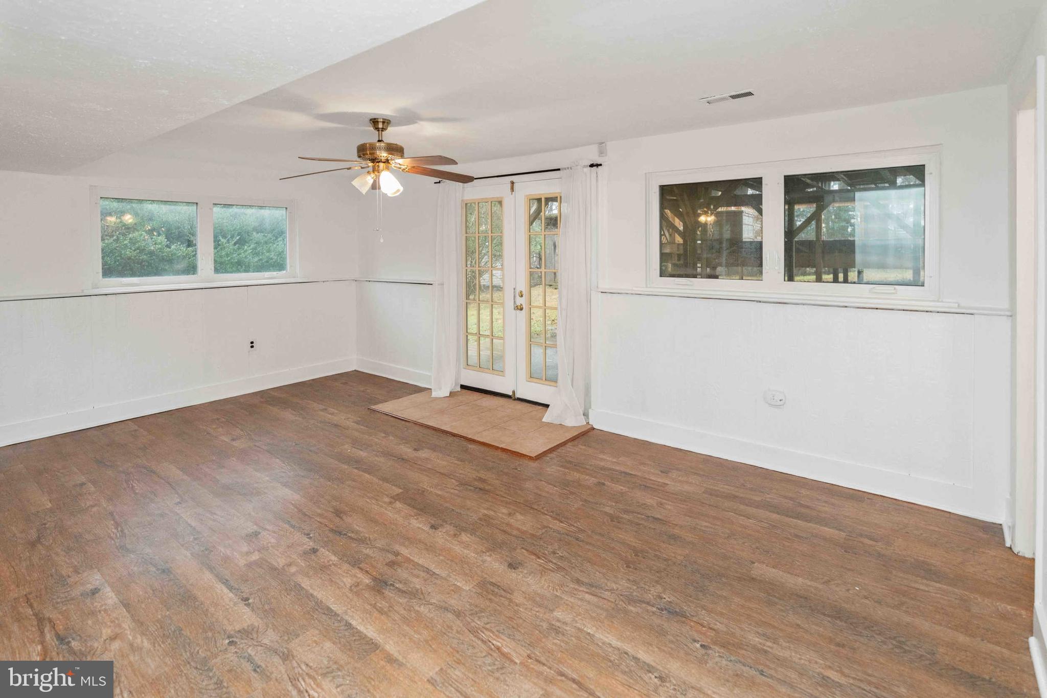 472 Woodward Drive Huntingdon Valley, PA 19006 - Photo 19 of 27 a view of empty room with wooden floor and fan
