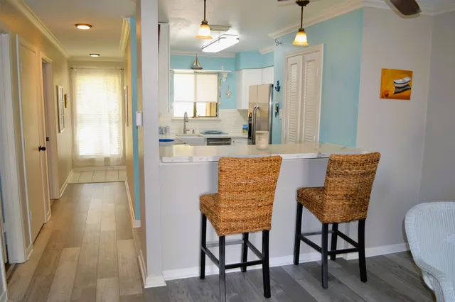 a kitchen with a stove microwave and refrigerator