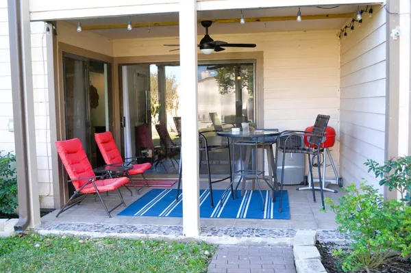 a front view of a house with a yard garage and outdoor seating