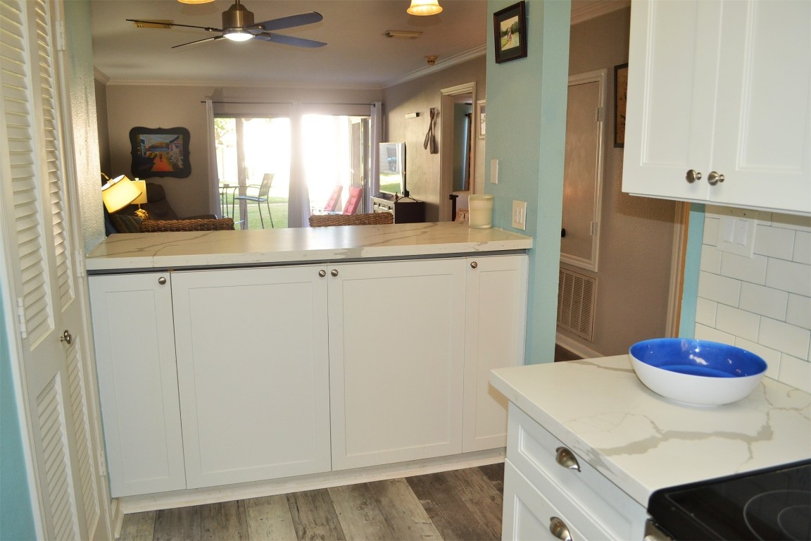 102 Lakeview Terrace, Unit D Conroe, TX 77356 - Photo 17 of 42 a kitchen with a sink and cabinets